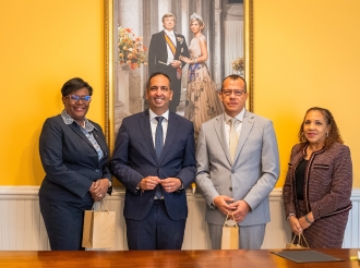 Ministro Dangui Oduber convenci cu bishita di PAHO tabata exitoso